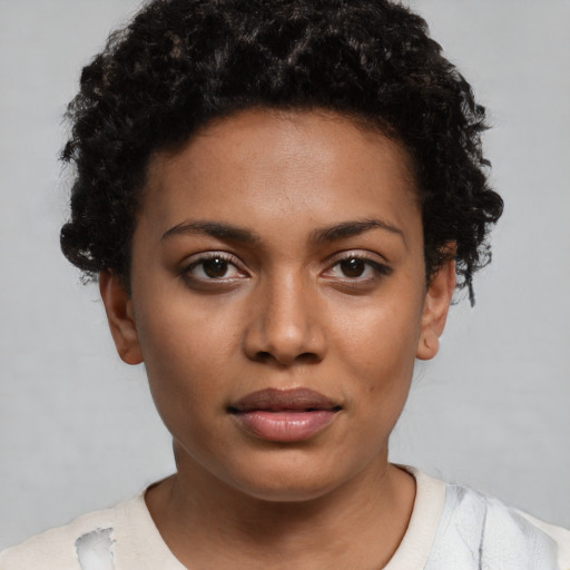 Neutral black young-adult female with short  black hair and brown eyes