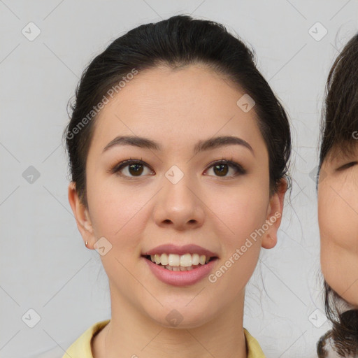 Joyful asian young-adult female with medium  brown hair and brown eyes