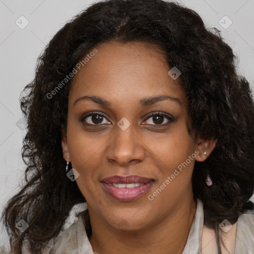 Joyful black adult female with medium  brown hair and brown eyes