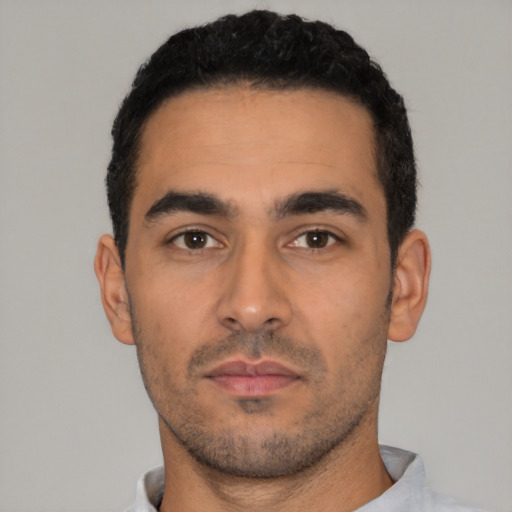 Neutral latino young-adult male with short  black hair and brown eyes
