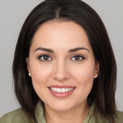 Joyful white young-adult female with medium  brown hair and brown eyes