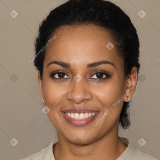 Joyful black young-adult female with short  brown hair and brown eyes