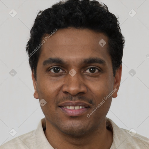 Joyful black young-adult male with short  black hair and brown eyes