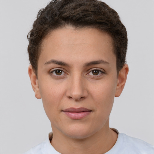 Joyful white young-adult female with short  brown hair and brown eyes