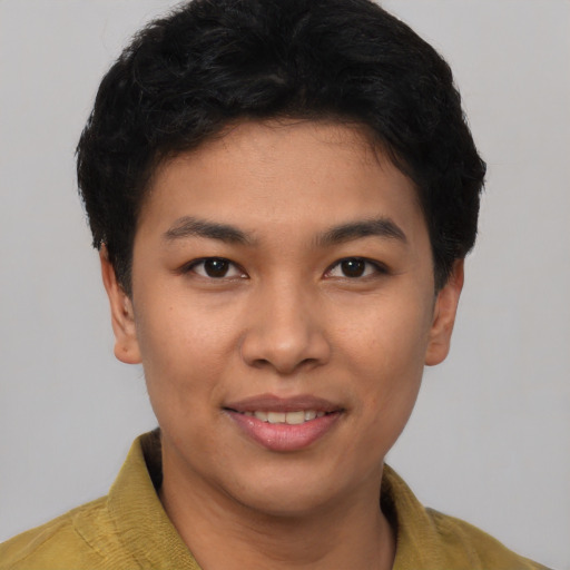 Joyful asian young-adult female with short  brown hair and brown eyes