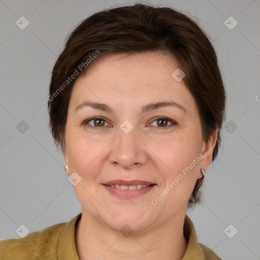 Joyful white adult female with medium  brown hair and brown eyes