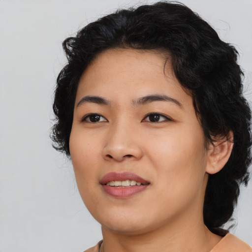 Joyful asian young-adult female with medium  black hair and brown eyes