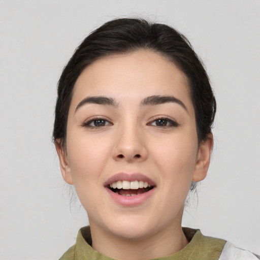 Joyful white young-adult female with medium  brown hair and brown eyes