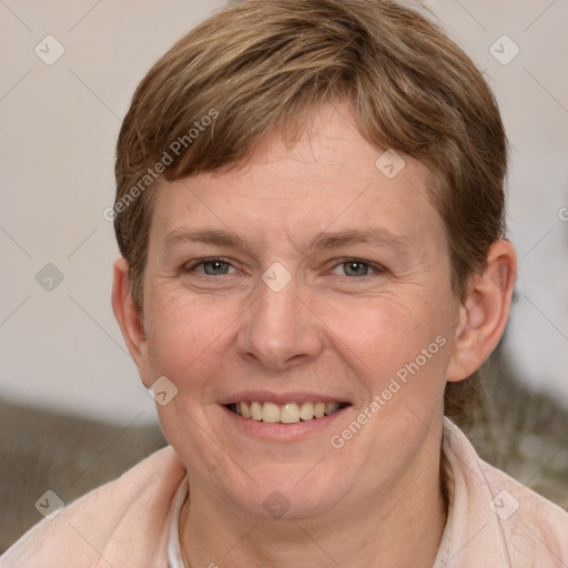 Joyful white adult female with medium  brown hair and grey eyes