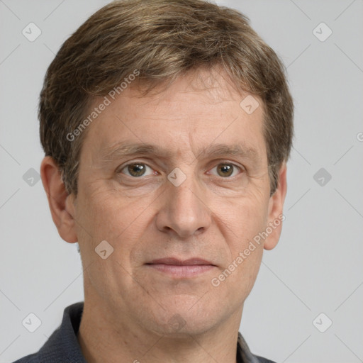 Joyful white adult male with short  brown hair and grey eyes