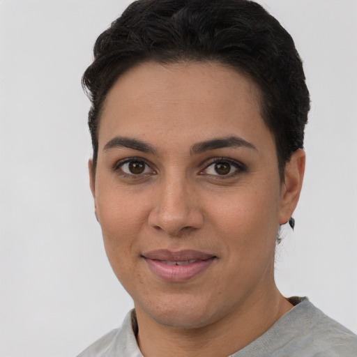 Joyful white young-adult female with short  brown hair and brown eyes