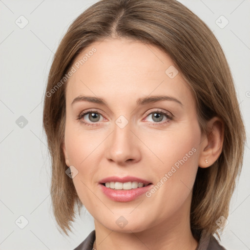 Joyful white young-adult female with medium  brown hair and grey eyes