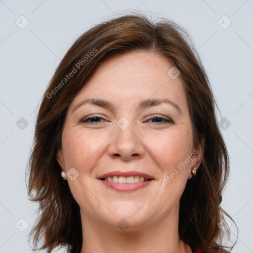 Joyful white adult female with medium  brown hair and brown eyes