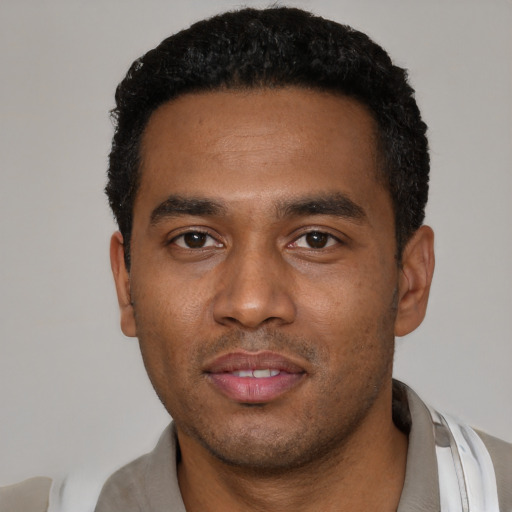 Neutral black young-adult male with short  black hair and brown eyes