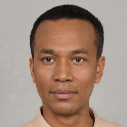 Neutral black young-adult male with short  black hair and brown eyes