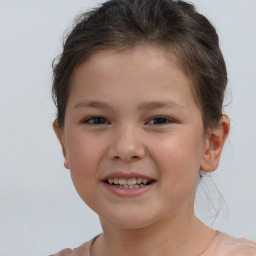 Joyful white child female with short  brown hair and brown eyes