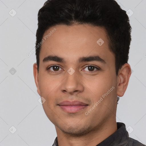 Joyful white young-adult male with short  black hair and brown eyes