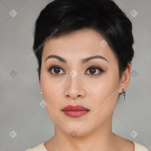 Joyful asian young-adult female with short  black hair and brown eyes