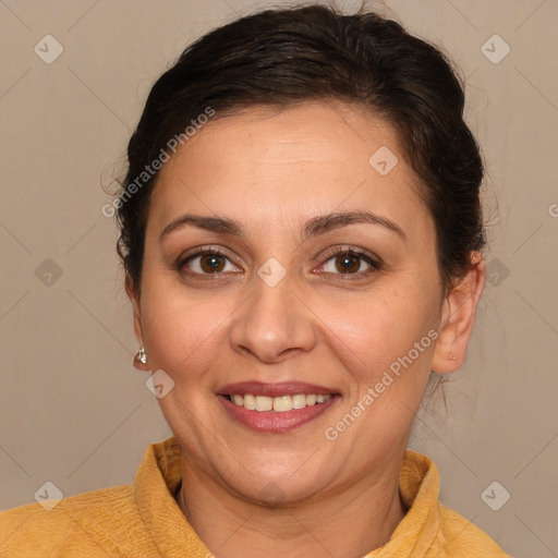 Joyful white adult female with medium  brown hair and brown eyes