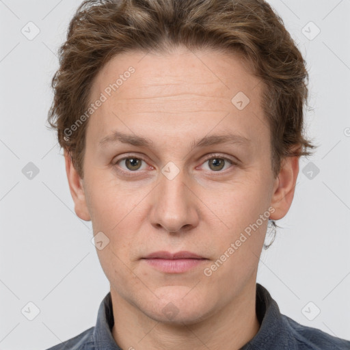 Joyful white adult female with short  brown hair and grey eyes