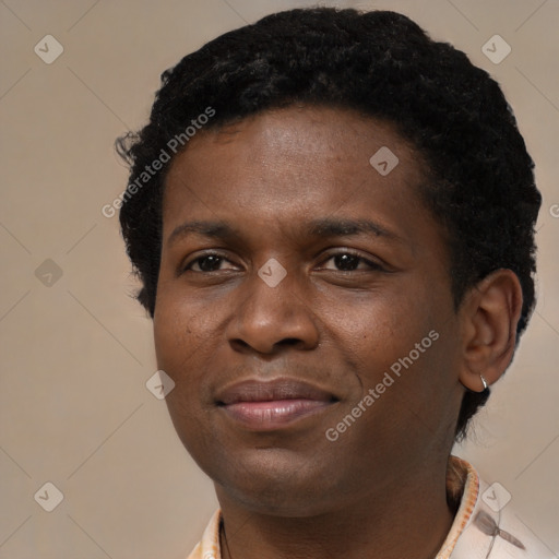 Joyful black young-adult male with short  black hair and brown eyes