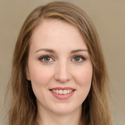 Joyful white young-adult female with long  brown hair and green eyes