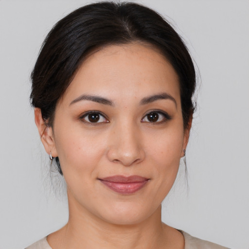 Joyful white young-adult female with medium  brown hair and brown eyes
