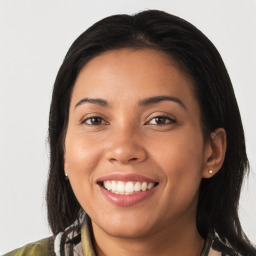 Joyful latino young-adult female with medium  brown hair and brown eyes