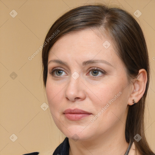 Joyful white adult female with medium  brown hair and brown eyes