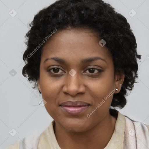 Joyful black young-adult female with long  brown hair and brown eyes