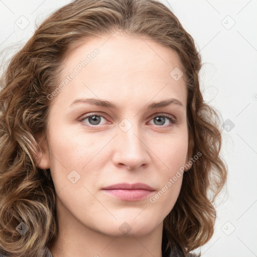 Joyful white young-adult female with long  brown hair and blue eyes