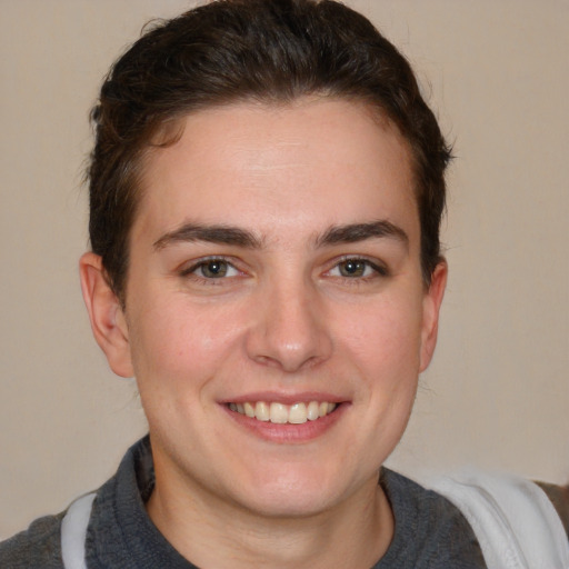 Joyful white young-adult male with medium  brown hair and brown eyes