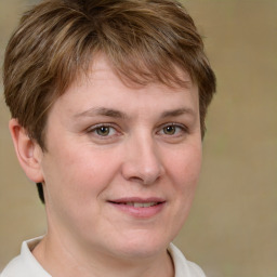 Joyful white adult female with short  brown hair and brown eyes