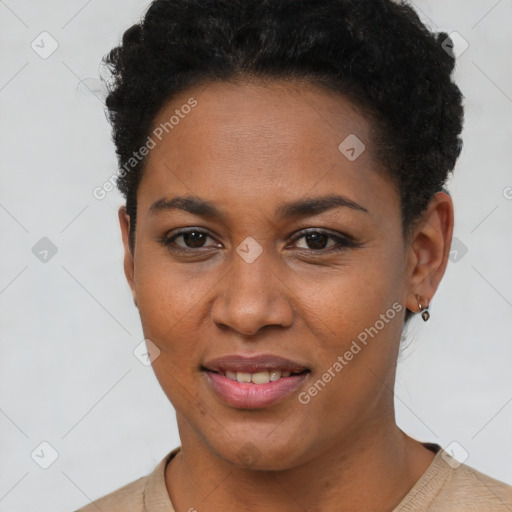 Joyful black young-adult female with short  brown hair and brown eyes
