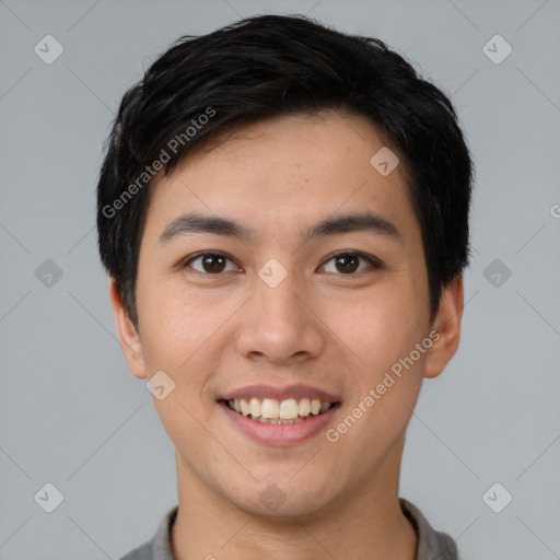 Joyful asian young-adult male with short  black hair and brown eyes