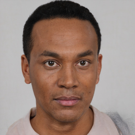 Neutral black young-adult male with short  black hair and brown eyes