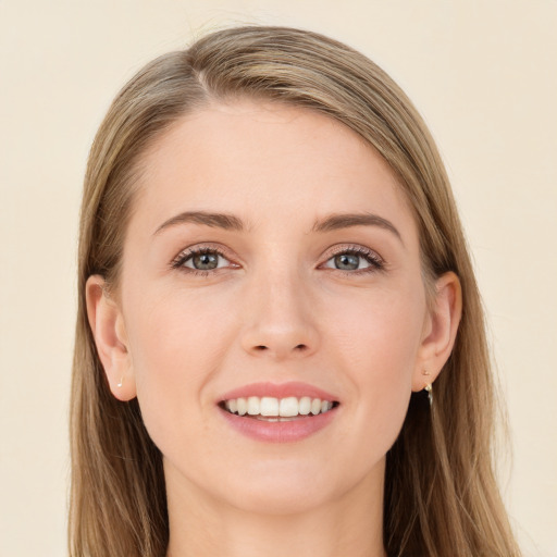 Joyful white young-adult female with long  brown hair and grey eyes