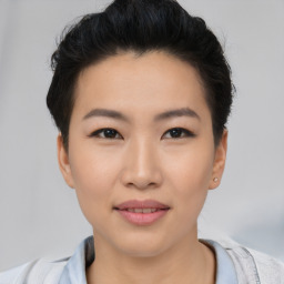 Joyful asian young-adult female with short  black hair and brown eyes