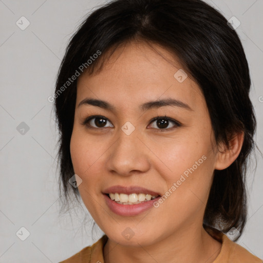 Joyful latino young-adult female with medium  brown hair and brown eyes