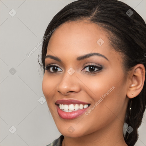 Joyful latino young-adult female with long  brown hair and brown eyes