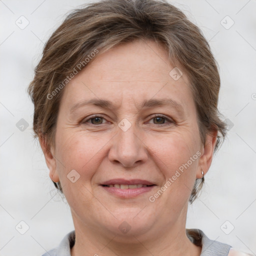 Joyful white adult female with short  brown hair and grey eyes