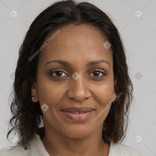 Joyful black adult female with medium  brown hair and brown eyes