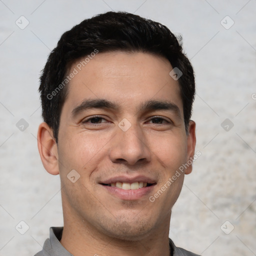 Joyful white young-adult male with short  black hair and brown eyes