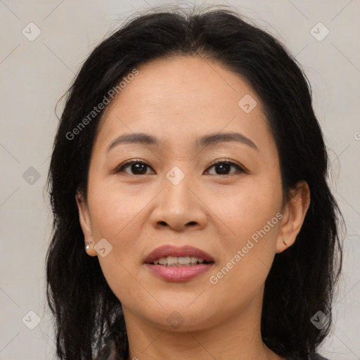 Joyful asian adult female with medium  brown hair and brown eyes