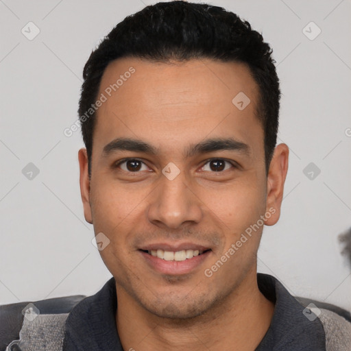 Joyful white young-adult male with short  black hair and brown eyes