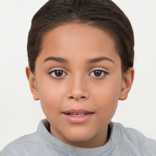 Joyful white child female with short  brown hair and brown eyes