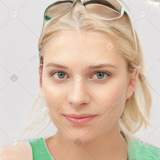 Joyful white young-adult female with medium  brown hair and blue eyes