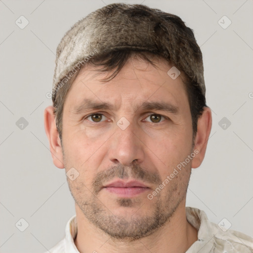 Joyful white adult male with short  brown hair and grey eyes