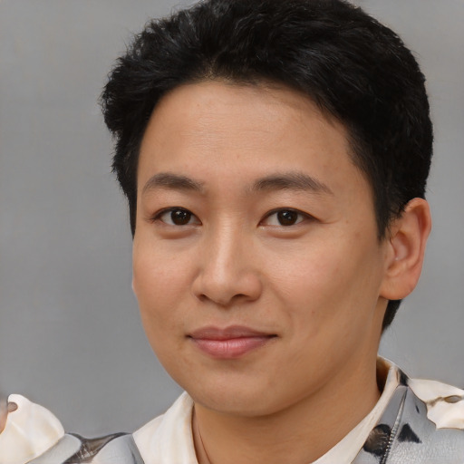 Joyful white young-adult female with short  black hair and brown eyes
