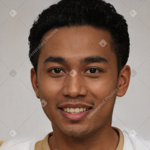 Joyful latino young-adult male with short  black hair and brown eyes